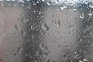Drops of water on the window after the rain. Macro closeup photo