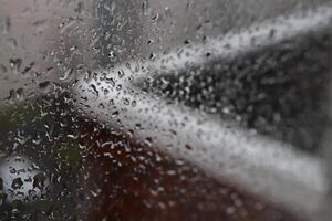 Drops of water on the window after the rain. Macro closeup photo