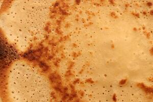 Toasted homemade pancake delicious backdrop texture. Macro closeup. photo