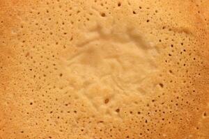 Clean sweet and warm pancake surface texture breakfast. Macro closeup. photo