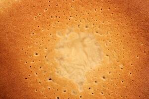 Backed sweet and warm pancake surface texture breakfast. Macro closeup. photo