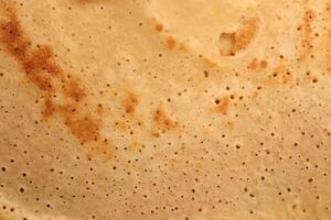 Light toasted tasty detail pancake background texture. Macro closeup. photo