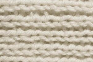White Wool Knitting Texture. Horizontal Along Weaving Crochet Detailed Rows. Sweater Textile Background. Macro Closeup. photo