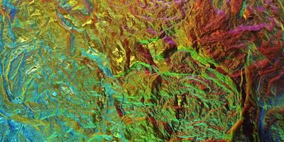 Colored light on textured surface. Chameleon stone rock surface texture. Holographic gradient background. photo