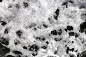 Sea wave foam texture. Outdoor water froth swirls backdrop. Marine aqua motion surface background. photo