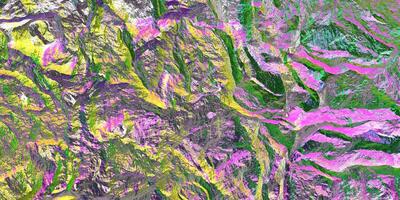 Colored light on textured surface. Chameleon stone rock surface texture. Holographic gradient background. photo