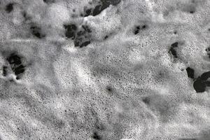 Marine aqua motion surface background. Sea wave foam texture. Outdoor water froth swirls backdrop. photo