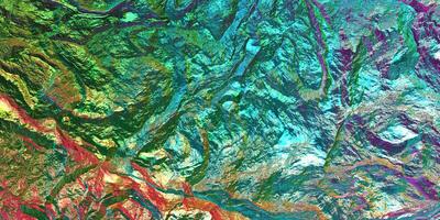 Chameleon stone rock surface texture. Holographic gradient background. Colored light on textured surface. photo