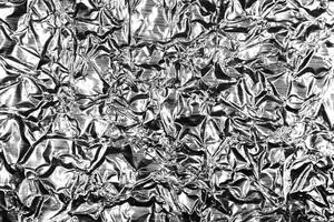 Monochrome Crumpled Metallic Black White Foil Background Texture.. photo