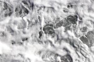 Sea wave foam texture. Marine aqua motion surface background. Outdoor water froth swirls backdrop. photo