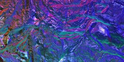 Chameleon stone rock surface texture. Holographic gradient background. Colored light on textured surface. photo