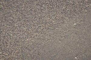 Sand texture with large and small grains transition. Summer beach background. photo