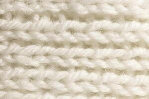White Wool Knitting Texture. Horizontal Along Weaving Crochet Detailed Rows. Sweater Textile Background. Macro Closeup. photo