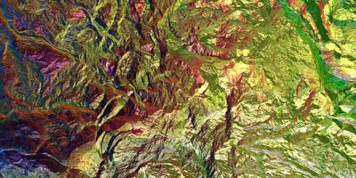 Colored light on textured surface. Chameleon stone rock surface texture. Holographic gradient background. photo