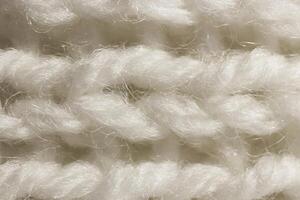White Wool Knitting Texture. Horizontal Along Weaving Crochet Detailed Rows. Sweater Textile Background. Macro Closeup. photo