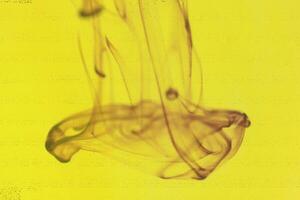 Liquid Drop Fantasy Art. Ink Drip in Water. Abstract Background. photo