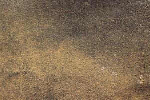 Black Yellow Sandpaper Texture. Rough Grit Abrasive Background. Used Grain Emery Backdrop. photo