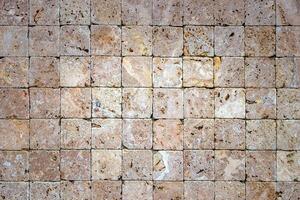Travertine masonry tiles cladding wall texture. Square stones surface background. photo