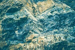 Laminate rock texture. Mountain pattern background. photo