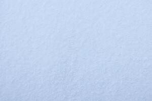 Nevado montículo textura. invierno ventisquero paisaje antecedentes. suave nieve colinas superficie. foto