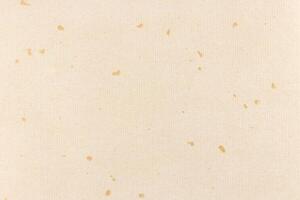 Decorative cream striped paper texture. Gold spots decorated paper with stripes background. Landscape horizontal orientation. photo