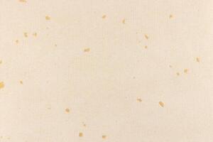 Decorative cream striped paper texture. Gold spots decorated paper with stripes background. Landscape horizontal orientation. photo