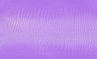 Seamless violet used wrap recycle plastic texture background. photo