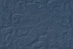 Seamless crumpled kraft blue paper texture. Empty textured sheet. photo