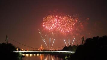 The colorful and beautiful fireworks show with the dark sky as background at night photo