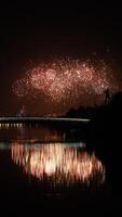 The colorful and beautiful fireworks show with the dark sky as background at night photo