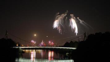 The colorful and beautiful fireworks show with the dark sky as background at night photo