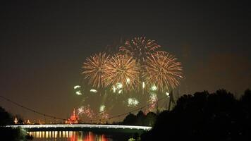 The colorful and beautiful fireworks show with the dark sky as background at night photo