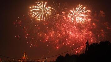 The colorful and beautiful fireworks show with the dark sky as background at night photo
