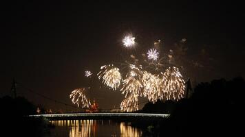 The colorful and beautiful fireworks show with the dark sky as background at night photo