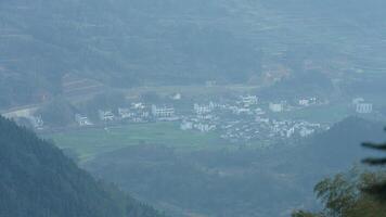 The beautiful mountains landscapes with the green forest and little village as background in the countryside of the China photo