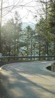 The beautiful mountains landscapes with the green forest and a plank road built along the face of a cliff in the countryside of the China photo