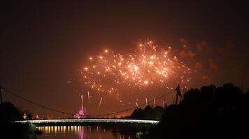 The colorful and beautiful fireworks show with the dark sky as background at night photo