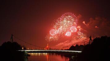 The colorful and beautiful fireworks show with the dark sky as background at night photo