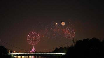 The colorful and beautiful fireworks show with the dark sky as background at night photo
