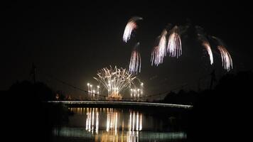 The colorful and beautiful fireworks show with the dark sky as background at night photo
