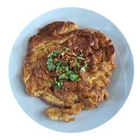 Freshly prepared Asian deep-fried crispy egg omelet. photo