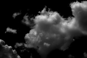Separate white clouds on a black background have real clouds. White clouds isolated on a black background are realistic clouds, Smoke explosions abstract clouds photo