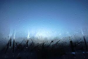 Window Rain, A serene blend of water and glass, Raindrops on Abstract Textured Glass photo