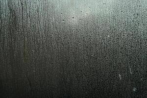 Window Rain, A serene blend of water and glass, Raindrops on Abstract Textured Glass photo