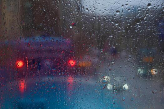 Window Rain and Blurred image of congested traffic, A serene blend of water and glass, Raindrops on Abstract Textured Glass photo