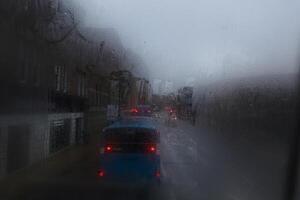 Window Rain and Blurred image of congested traffic, A serene blend of water and glass, Raindrops on Abstract Textured Glass photo