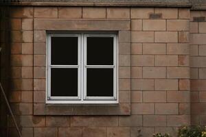 Vintage Window Embedded in Stone Wall of an Ancient House photo