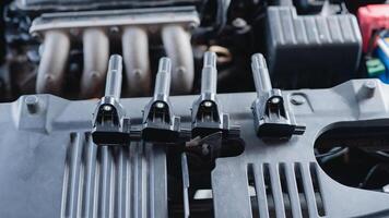 Automotive maintenance involves checking the ignition coil to keep the automobile running smoothly and prevent machine failures. photo