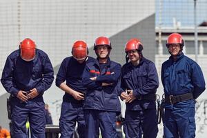 A team of confident and accomplished firefighters strides purposefully in their uniforms, exuding pride and satisfaction after successfully completing a challenging firefighting mission photo