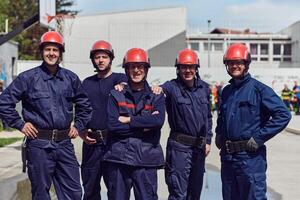 A team of confident and accomplished firefighters strides purposefully in their uniforms, exuding pride and satisfaction after successfully completing a challenging firefighting mission photo